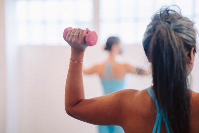 Woman with dumbell