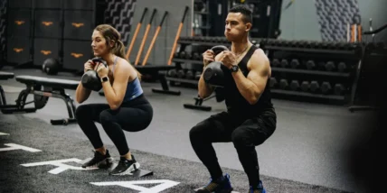 an image of two LA Fitness members working out