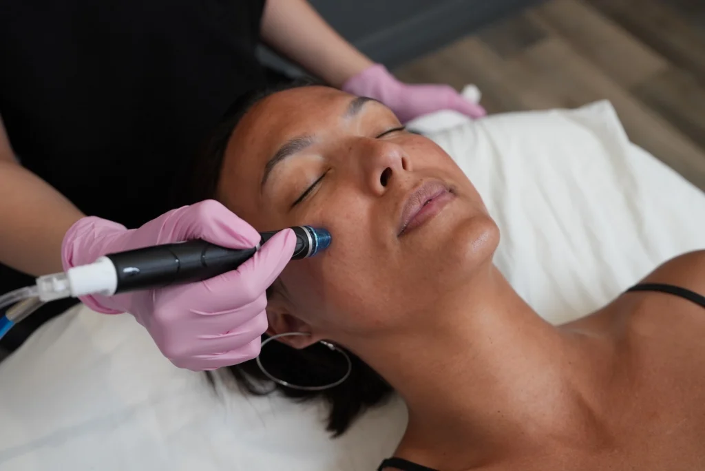 woman receives a cosmetic facial treatment