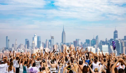 People have a party overlooking a city skyline