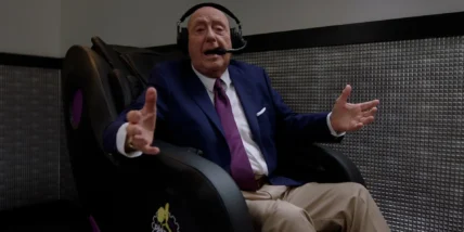 Dick Vitale in a Planet Fitness massage chair.