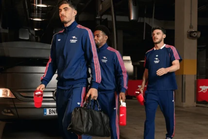 Arsenal FC players carry Stanley 1913 tumbler cups