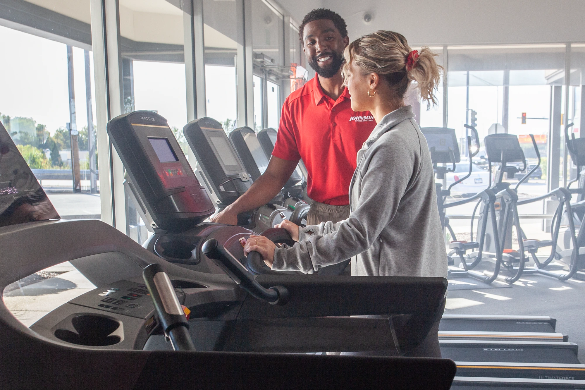 woman shops for a treadmill
