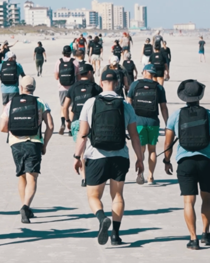 people walking wearing backpacks